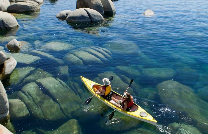 a photo of two people paddling a kayak in Lake Tahoe