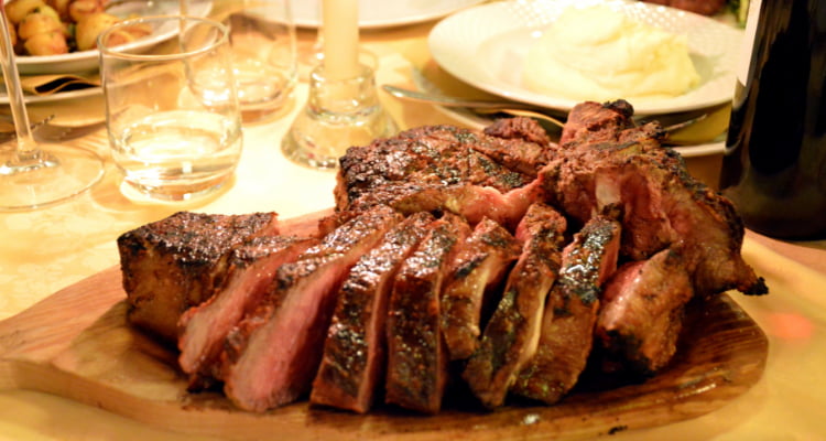 Juicy Bistecca Alla Fiorentina Steak on a Grill.
